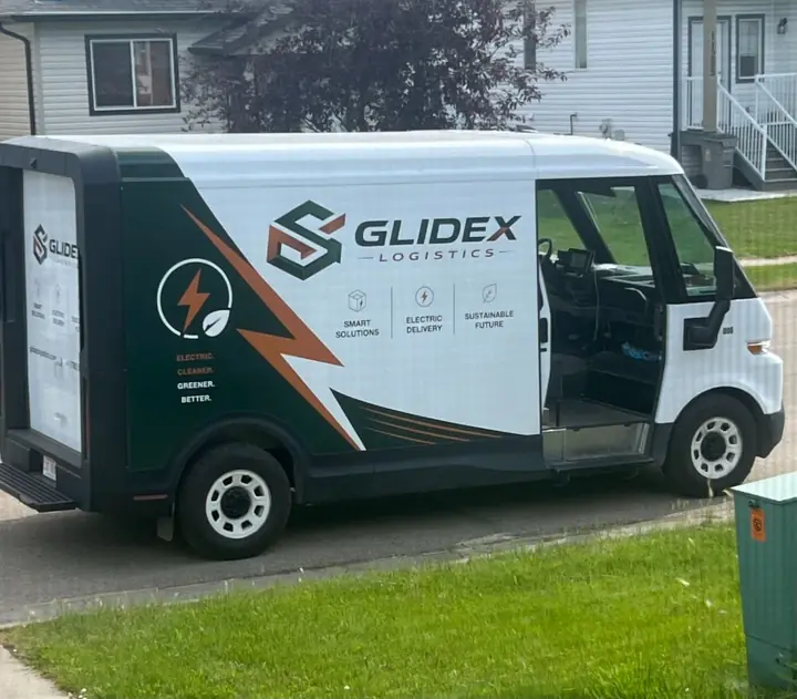 GlideX Logistics electric delivery van on the road in Grande Prairie